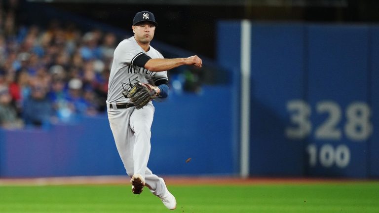 New York Yankees shortstop Isiah Kiner-Falefa throws to first to force out vs. Toronto Blue Jays during MLB baseball action in Toronto on Tuesday, September 27, 2022. (Nathan Denette/CP Photo)