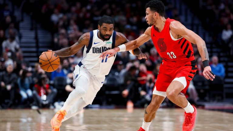 Dallas Mavericks guard Kyrie Irving drives against Portland Trail Blazers forward Toumani Camara during the first half of an NBA basketball game Friday, Dec. 8, 2023, in Portland, Ore. (Howard Lao/AP Photo)