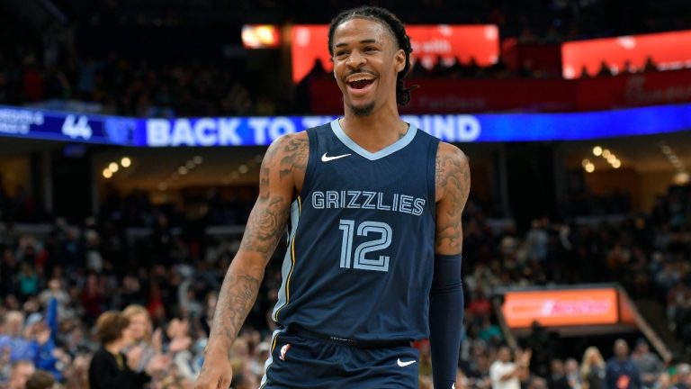 Memphis Grizzlies guard Ja Morant (12) reacts in the first half of an NBA basketball game against the Indiana Pacers, Thursday, Dec. 21, 2023, in Memphis, Tenn. (AP Photo/Brandon Dill)