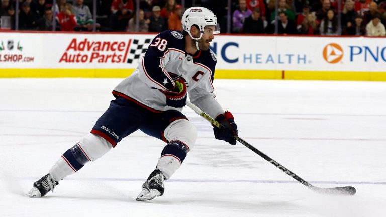 Columbus Blue Jackets' Boone Jenner (38) controls the puck against the Carolina Hurricanes during the first period of an NHL hockey game in Raleigh, N.C., Sunday, Nov. 26, 2023. (Karl B DeBlaker/AP)