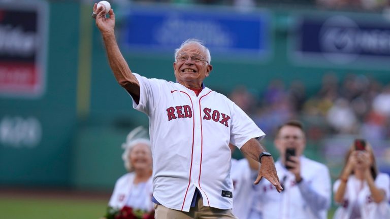 Boston Red Sox broadcaster Joe Castiglione throws a ceremonial first pitch before a baseball game between the Cleveland Guardians and the Red Sox, Thursday, July 28, 2022, in Boston. The Red Sox honored Castiglione before the game for his 40 years on the air with the team. (Steven Senne/AP)