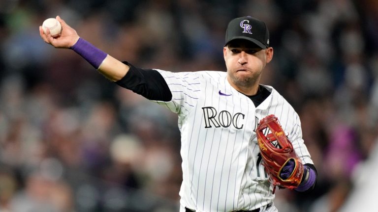 Colorado Rockies shortstop Jose Iglesias (11) throws to first in the ninth inning of a baseball game, Saturday, Aug. 20, 2022, in Denver.(David Zalubowski/AP Photo)