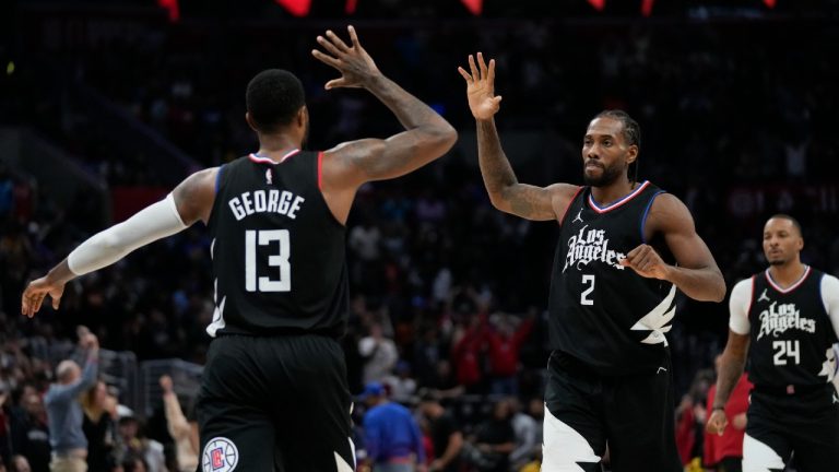 LA Clippers forward Paul George (13) celebrates with forward Kawhi Leonard (2) after scoring a 3-pointer during the second half of an NBA basketball game against the Golden State Warriors in Los Angeles, Saturday, Dec. 2, 2023. The Clippers won 113-112. (Ashley Landis/AP)