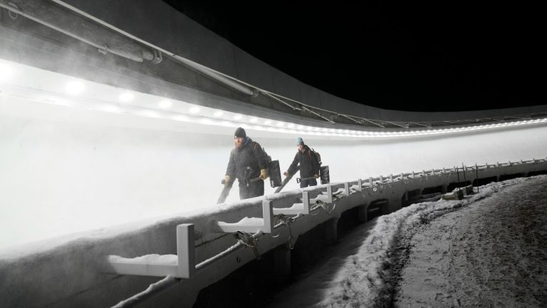 Workers perform maintenance on the track for the Luge World Cup in Lake Placid, N.Y., Thursday, Dec. 7, 2023. (Seth Wenig/AP)