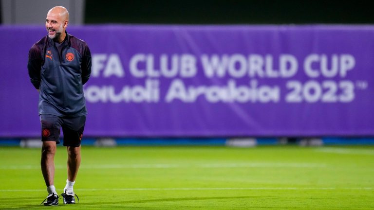 Manchester City's head coach Pep Guardiola laughs during a training session at the King Abdullah Sports City Stadium in Jeddah, Saudi Arabia, Monday, Dec. 18, 2023. Urawa Reds will play against Manchester City during the semifinal soccer match during the Club World Cup on Tuesday Dec. 19.(AP Photo/Manu Fernandez)