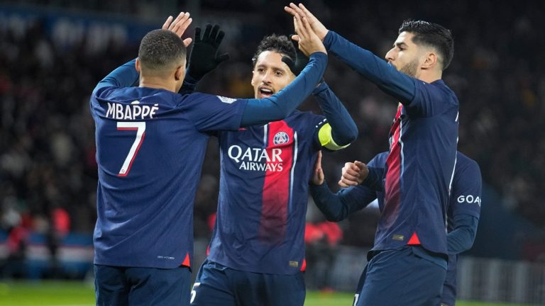 PSG's Kylian Mbappe, left, celebrates with teammates after scoring his side's third goal during the French League One soccer match between Paris Saint-Germain and Metz at the Parc des Princes in Paris, Wednesday, Dec 20, 2023. (Michel Euler/AP)