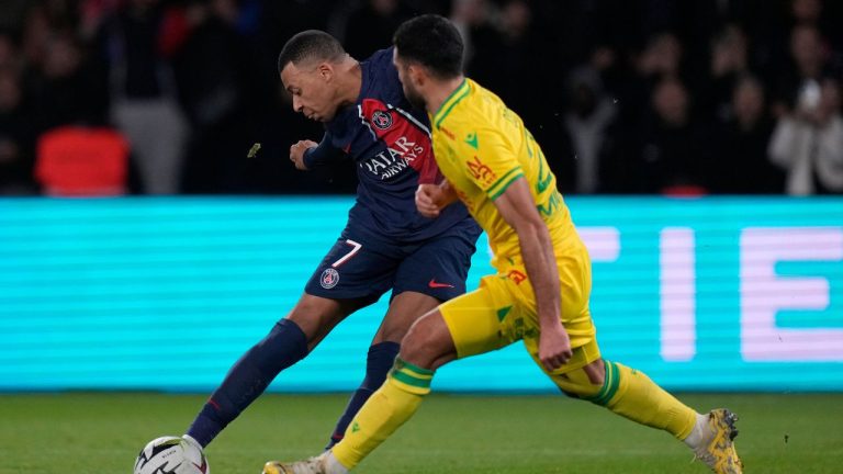 Nantes' Eray Comert tries to block a shot from PSG's Kylian Mbappe during the French League 1 soccer match between Paris Saint-Germain and Nantes at the Parc des Princes in Paris, Saturday, Dec. 9, 2023. (Thibault Camus/AP Photo)