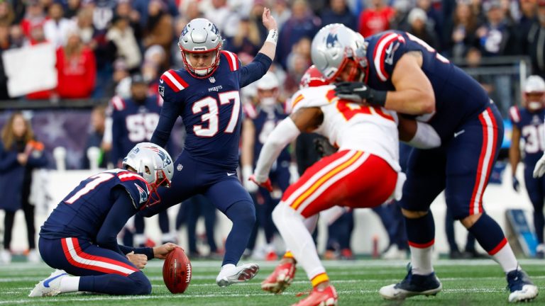 New England Patriots punter Bryce Baringer (17) holds the ball for place kicker Chad Ryland (37) during an extra point attempt in the first half of an NFL football game against the Kansas City Chiefs on Sunday, Dec. 17, 2023, in Foxborough, Mass. (AP Photo/Greg M. Cooper)