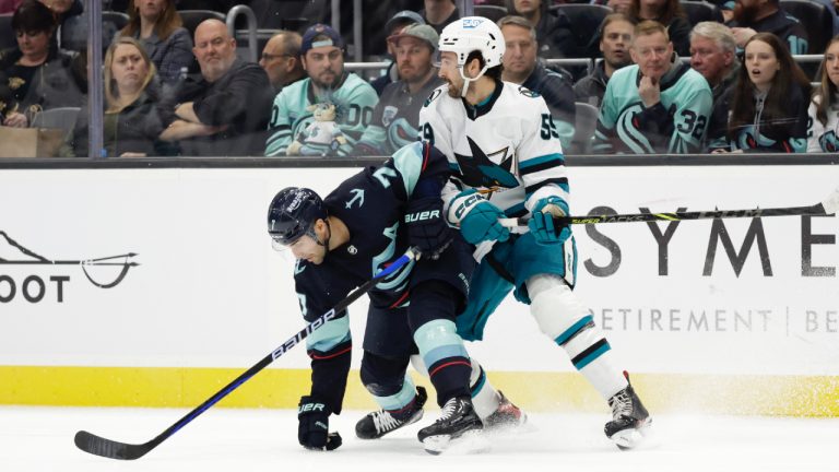 Seattle Kraken right wing Jordan Eberle (7) vies for the puck against San Jose Sharks defenseman Nick Cicek (59) during the second period of an NHL hockey game Wednesday, Nov. 23, 2022, in Seattle. (John Froschauer/AP)