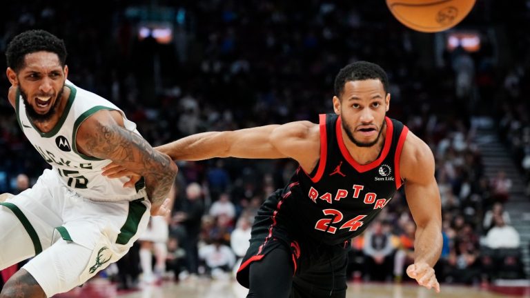 Milwaukee Bucks' Cameron Payne (left) and Toronto Raptors' Markquis Nowell (24) battle for the ball during second half NBA basketball action in Toronto on Wednesday, Nov. 15, 2023. (Frank Gunn/CP)