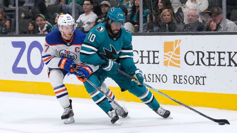 San Jose Sharks left wing Anthony Duclair (10) tries to keep the puck from Edmonton Oilers centre Connor McDavid (97) during the first period of an NHL hockey game Thursday, Dec. 28, 2023, in San Jose, Calif. (Tony Avelar/AP)