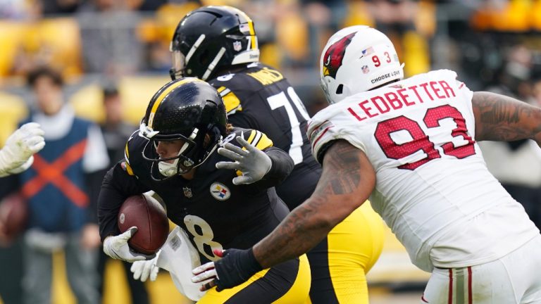 Pittsburgh Steelers quarterback Kenny Pickett (8) tries to get past Arizona Cardinals defensive end Jonathan Ledbetter (93) during the first half of an NFL football game Sunday, Dec. 3, 2023, in Pittsburgh. (Matt Freed/AP)