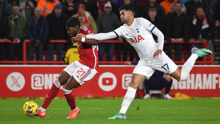 Tottenham's Cristian Romero challenges for the ball with Nottingham Forest's Anthony Elanga during the Premier League match between Nottingham Forest and Tottenham Hotspur at City ground in Nottingham, England, Friday, Dec. 15, 2023. (Rui Vieira/AP Photo)