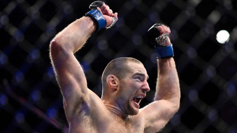 American Sean Strickland celebrates defeating Nigerian-born New Zealander Israel Adesanya to claim the middleweight title by unanimous decision in the main event of UFC 293 in Sydney, Sunday, Sept. 10, 2023. (Dan Himbrechts/AAP Image via AP)