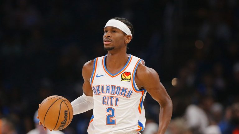 Oklahoma City Thunder guard Shai Gilgeous-Alexander (2) dribbles the ball during the first half of an NBA basketball game against the Golden State Warriors Friday, Dec. 8, 2023, in Oklahoma City. (AP Photo/Nate Billings)