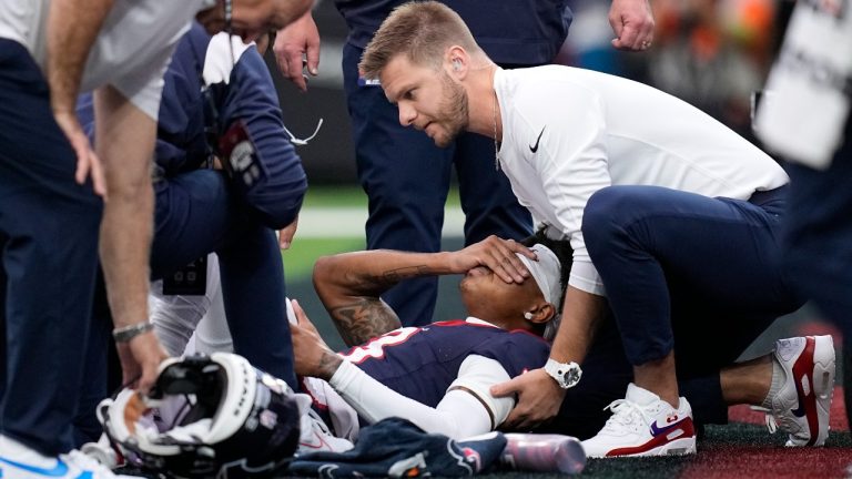 Houston Texans wide receiver Tank Dell is attended to after being injured in the first half of an NFL football game against the Denver Broncos Sunday, Dec. 3, 2023, in Houston. (Eric Gay/AP)