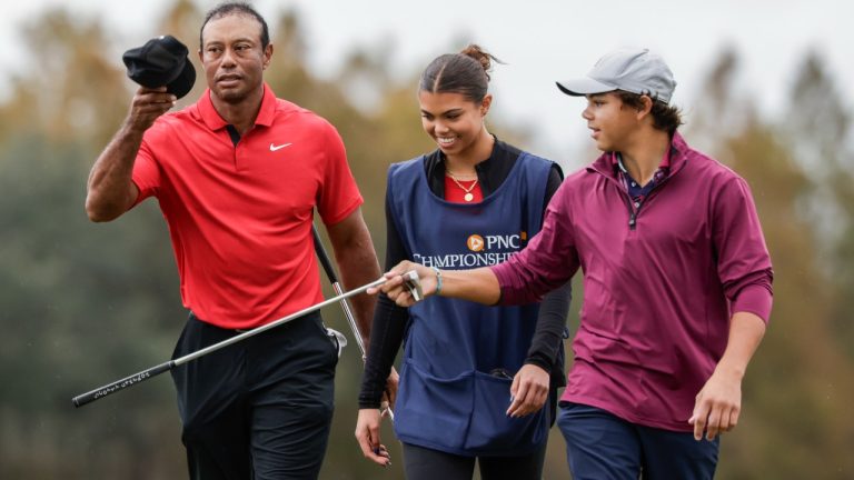 Tiger Woods, left; daughter Sam, center; and son Charlie, right; during the final round of the PNC Championship golf tournament, Sunday, Dec. 17, 2023, in Orlando, Fla. (Kevin Kolczynski/AP)