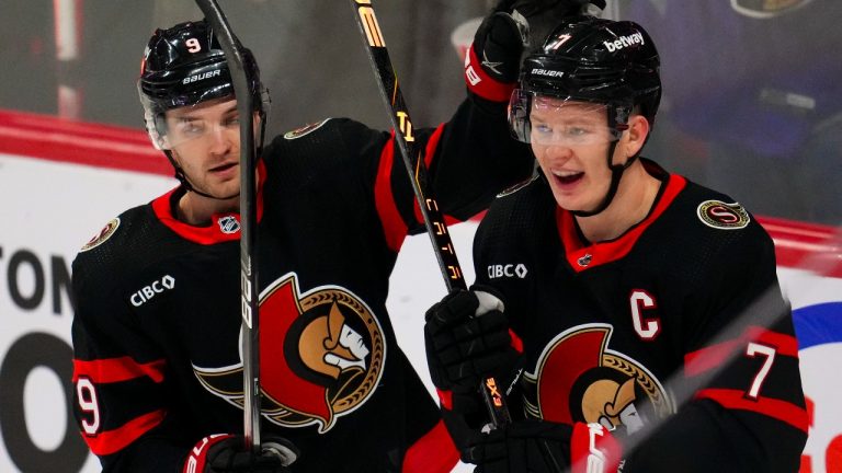 Ottawa Senators left wing Brady Tkachuk (7) celebrates his goal with teammate Josh Norris (9) against the New York Rangers during first period NHL hockey action in Ottawa on Tuesday, Dec. 5, 2023. (Sean Kilpatrick/CP)