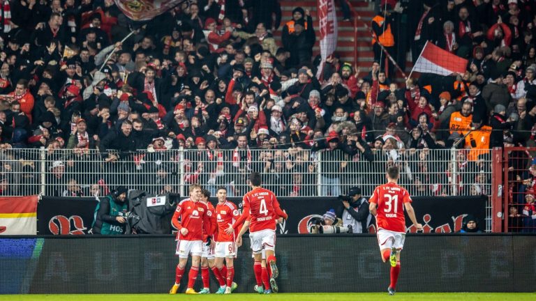 Union players cheer with the fans after the 3:0 goal during the Bundesliga soccer match between FC Union Berlin and Borussia Mönchengladbach at An der Alten Forsterei stadium, Berlin, Saturday Dec. 9, 2023. (Andreas Gora/AP Photo)