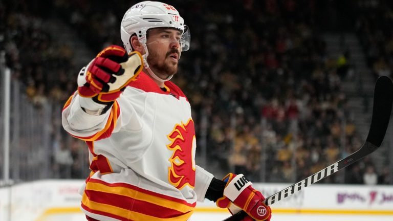 Calgary Flames defenceman MacKenzie Weegar (52) celebrates after scoring against the Vegas Golden Knights during the first period of an NHL hockey game Tuesday, Dec. 12, 2023, in Las Vegas. (John Locher/AP)