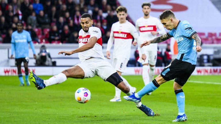 Leverkusen's Alex Grimaldo, right, in action against Stuttgart's Josha Vagnoman during the Bundesliga soccer match between Bayer Leverkusen and VfB Stuttgart at MHP Arena stadium in Stuttgart, Germany, Sunday Dec. 10, 2023. (Tom Weller/dpa via AP)