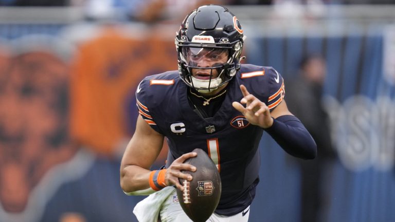 Chicago Bears quarterback Justin Fields signals to a teammate during the first half of an NFL football game against the Detroit Lions Sunday, Dec. 10, 2023, in Chicago. (Erin Hooley/AP)