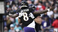 Lamar Jackson&#8217;s perfect passer rating helps Ravens rout Dolphins to clinch top seed in AFC