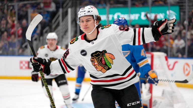 Chicago Blackhawks' Connor Bedard celebrates after scoring during the first period of a game against the St. Louis Blues. (Jeff Roberson/AP)