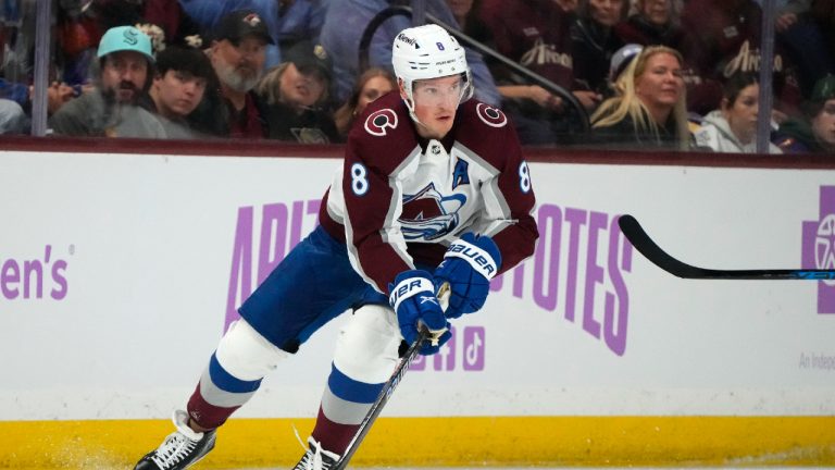 Colorado Avalanche defenseman Cale Makar skates with the puck against the Arizona Coyotes during the second period of an NHL hockey game Thursday, Nov. 30, 2023, in Tempe, Ariz. (Ross D. Franklin/AP)