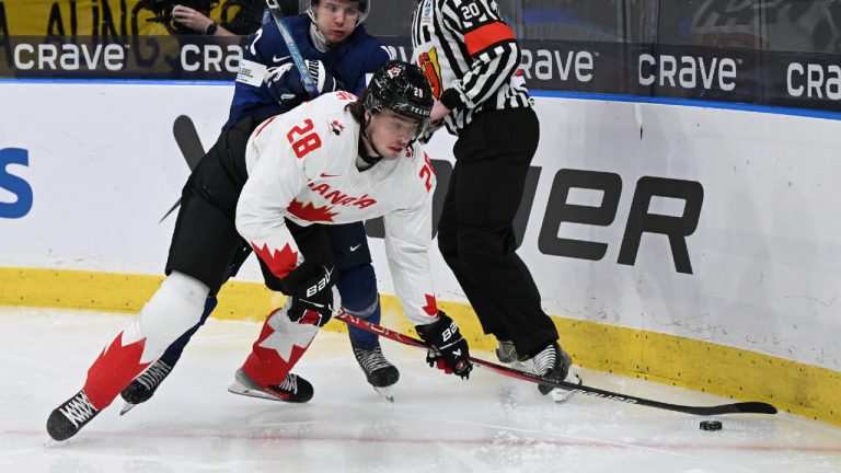 Canada's Conor Geekie, front, in action during the IIHF World Junior Championship group A ice hockey match between Finland and Canada at Scandinavium in Gothenburg, Sweden, Tuesday, Dec. 26, 2023. (Björn Larsson Rosvall/TT News Agency via AP)