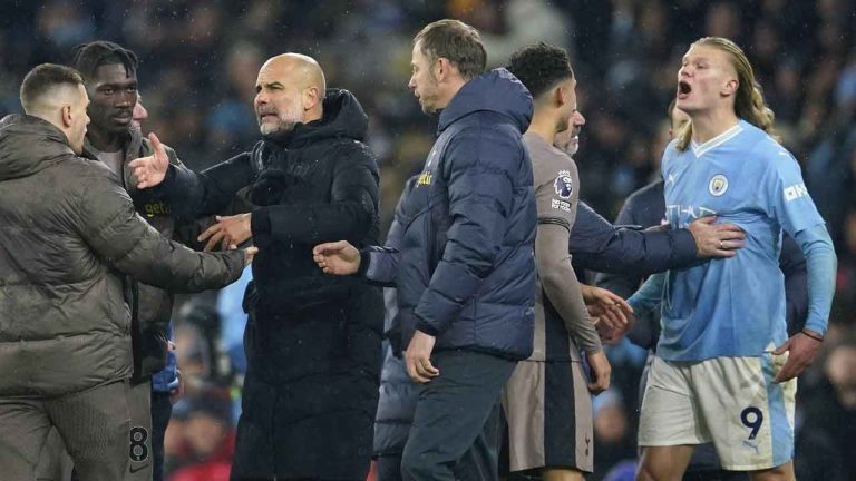 Manchester City's head coach Pep Guardiola, 3rd left, speaks with Tottenham team staff while Manchester City's Erling Haaland, right, argues with Tottenham players, at the end of the English Premier League soccer match between Manchester City and Tottenham Hotspur at Etihad stadium in Manchester, England. (Dave Thompson/AP)
