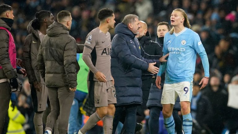 Tottenham's head coach Ange Postecoglou, center right, holds back Manchester City's Erling Haaland, right, arguing with Tottenham players at the end of the English Premier League soccer match between Manchester City and Tottenham Hotspur at Etihad stadium in Manchester, England, Sunday, Dec. 3, 2023. The game ended in a 3-3 draw. (Dave Thompson/AP)