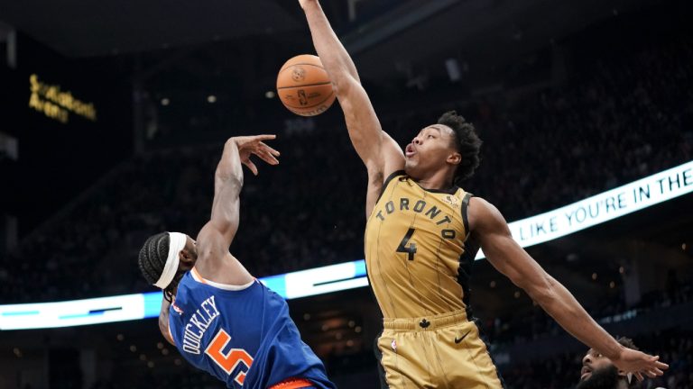 Toronto Raptors forward Scottie Barnes (4) jumps to block a shot by New York Knicks guard Immanuel Quickley (5) during second half NBA basketball action in Toronto on Friday, December 1, 2023. (Arlyn McAdorey/CP)