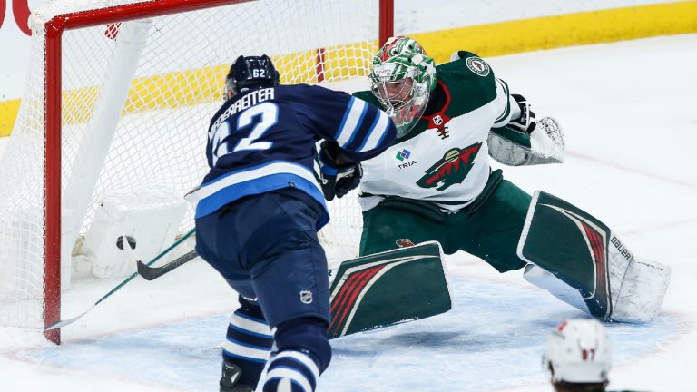 Winnipeg Jets' Nino Niederreiter (62) scores against Minnesota Wild goaltender Filip Gustavsson (32) during first period NHL action in Winnipeg on Saturday, December 30, 2023. (John Woods/CP)