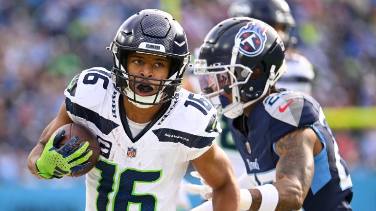 Seattle Seahawks wide receiver Tyler Lockett (16) runs against Tennessee Titans cornerback Tre Avery during the second half of an NFL football game on Sunday, Dec. 24, 2023, in Nashville, Tenn. (John Amis/AP Photo)