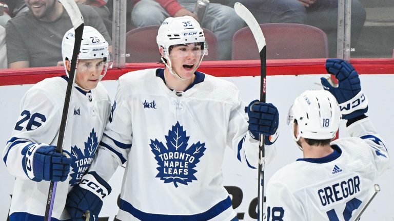 Toronto Maple Leafs' Fraser Minten (39) celebrates with teammates Nick Abruzzese (26) and Noah Gregor (18) after scoring against the Montreal Canadiens during second period NHL preseason hockey action in Montreal, Saturday, Sept. 30, 2023. (Graham Hughes/THE CANADIAN PRESS)