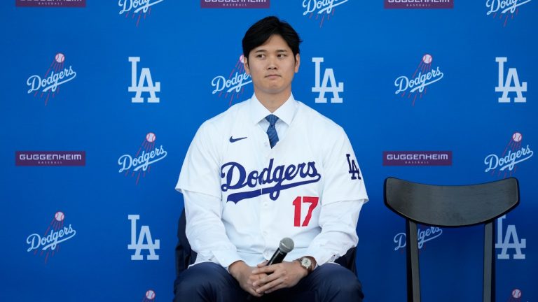 Los Angeles Dodgers' Shohei Ohtani listens to questions during a baseball news conference at Dodger Stadium Thursday, Dec. 14, 2023, in Los Angeles. (Ashley Landis/AP Photo)