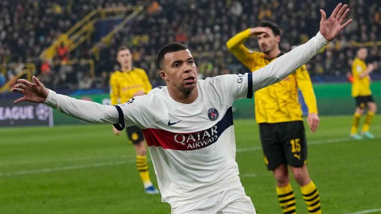 PSG's Kylian Mbappe celebrates after scoring a goal that was later disallowed during the Champions League Group F soccer match between Borussia Dortmund and Paris Saint-Germain at the Signal Iduna Park in Dortmund. (Martin Meissner/AP)