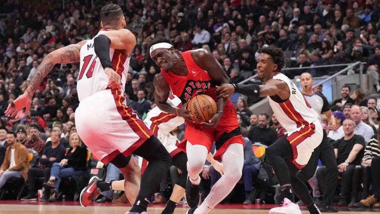 Toronto Raptors' Pascal Siakam drives between Miami Heat's Caleb Martin, left, and Josh Richardson during first half NBA basketball action in Toronto. (Chris Young/THE CANADIAN PRESS)