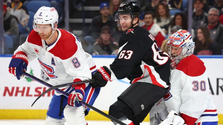 Montreal Canadiens defenseman Mike Matheson (8) and Buffalo Sabres right wing Isak Rosen (63) work for position in front of Canadiens goaltender Cayden Primeau (30) during the first period of an NHL hockey game Saturday, Dec. 9, 2023, in Buffalo, N.Y. (Jeffrey T. Barnes/AP Photo)