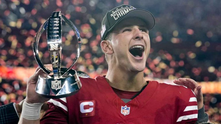 San Francisco 49ers quarterback Brock Purdy celebrates with the trophy after their win against the Detroit Lions in the NFC Championship NFL football game. (Godofredo A. Vasquez/AP)