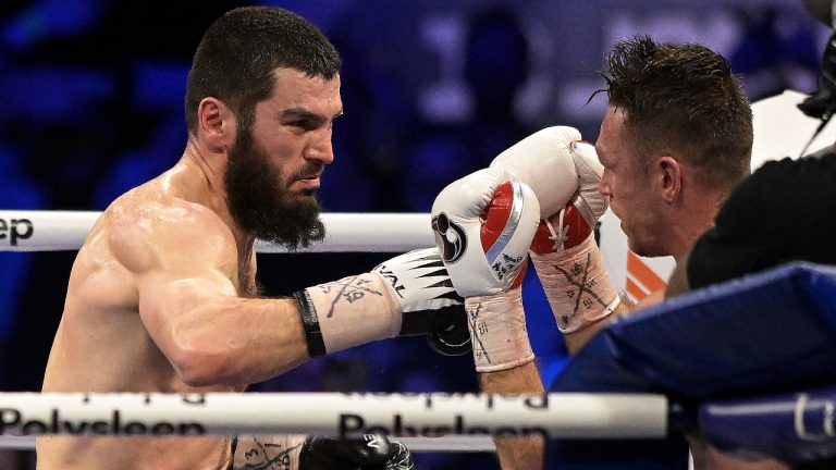 Artur Beterbiev, left, and Callum Smith fight for world unified light heavyweight boxing match, in Quebec City, Saturday, Jan. 13, 2024. (Patrice Laroche/CP)