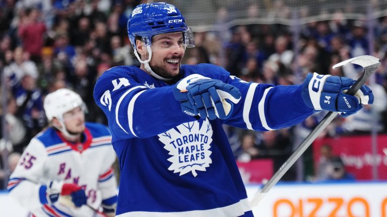 Toronto Maple Leafs forward Auston Matthews (34) celebrates his goal against the New York Rangers during second period NHL hockey action in Toronto on Tuesday, December 19, 2023. THE CANADIAN PRESS/Nathan Denette