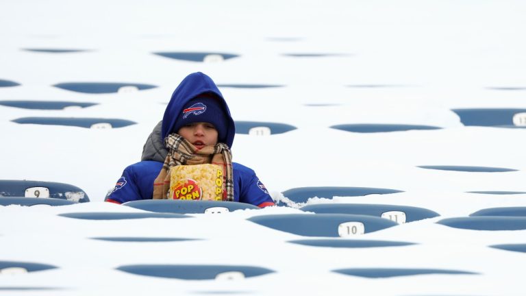 A Buffalo Bills fan sits amongst snow covered seats while waiting for the start an NFL wild-card playoff football game between the Buffalo Bills and the Pittsburgh Steelers, Monday, Jan. 15, 2024, in Buffalo, N.Y. (Jeffrey T. Barnes/AP)