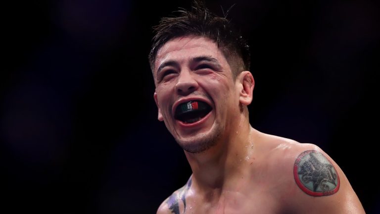 Mexico's Brandon Moreno celebrates victory over Brazil's Gilbert Durinho in a flyweight title bout at the UFC 283 mixed martial arts event in Rio de Janeiro early Sunday, Jan. 22, 2023. (AP Photo/Bruna Prado)