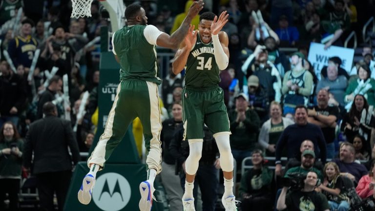 Milwaukee Bucks' Giannis Antetokounmpo and Thanasis Antetokounmpo celebrate during the second half of an NBA basketball game Wednesday, Jan. 24, 2024, in Milwaukee. The Bucks won 126-116. (Morry Gash/AP)