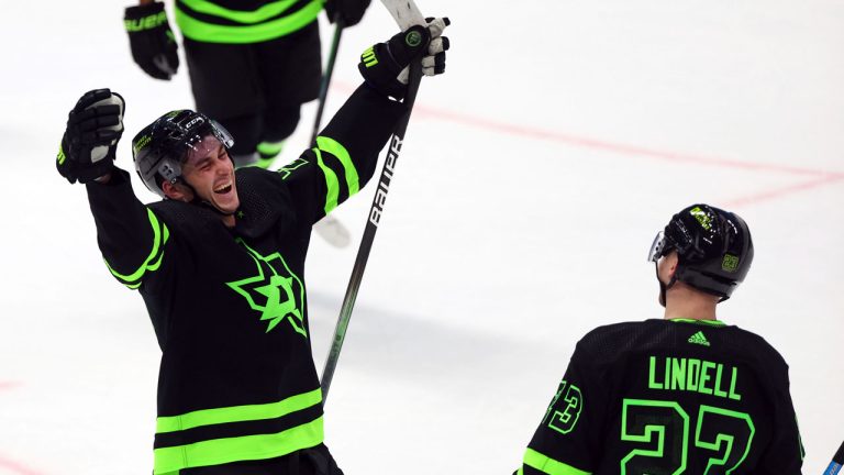 Dallas Stars left wing Mason Marchment (27) celebrates with defenseman Esa Lindell (23) after scoring his third goal for a hat trick against the Chicago Blackhawks in the third period of an NHL hockey game Sunday, Dec. 31, 2023, in Dallas. (Richard W. Rodriguez/AP)