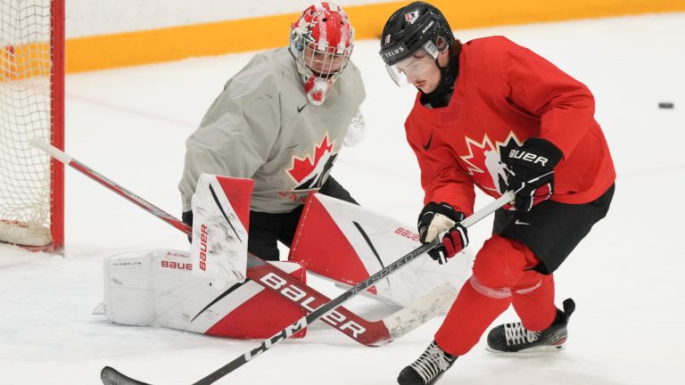 Jagger Firkus, right, does drills with Canada's goaltender Scott Ratzlaff during practice at the IIHF World Junior Hockey Championship in Gothenburg, Sweden, Monday, Jan. 1, 2024. (Christinne Muschi/CP)