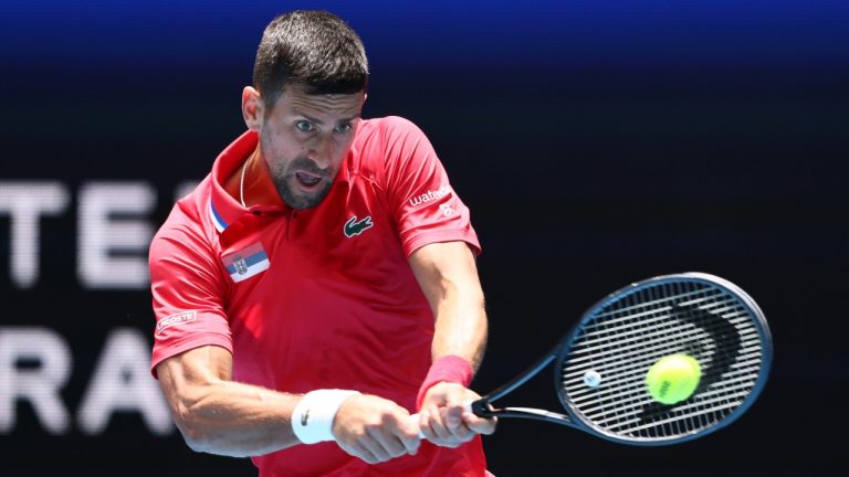 Novak Djokovic of Serbia hits a return to Jiri Lehecka of the Czech Republic during the United Cup tennis tournament in Perth, Australia, Tuesday, Jan. 2, 2024. (AP)