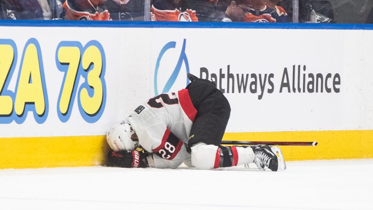 The Senators' Claude Giroux (28) reacts after being injured against the Edmonton Oilers during first period NHL action in Edmonton on Saturday January 6, 2024. (Jason Franson/CP)